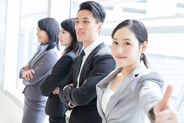 istock business team show thumb up 522558406