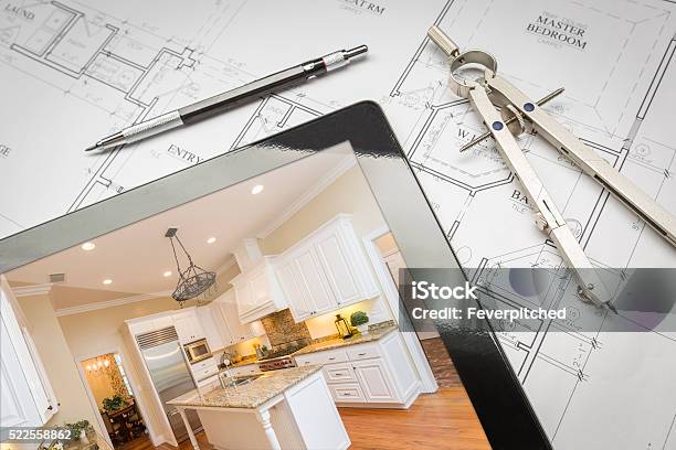 Computer Tablet Showing Finished Kitchen On House Plans Pencil Stock Photo - Download Image Now