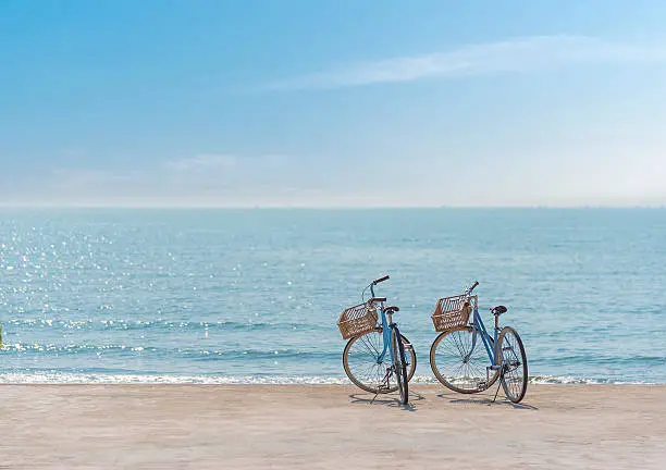 Two bicycle on the seaside at blue sky