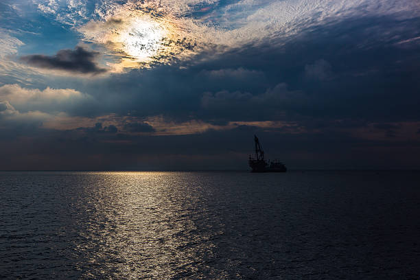istock Crane barge in the sunset 522559850