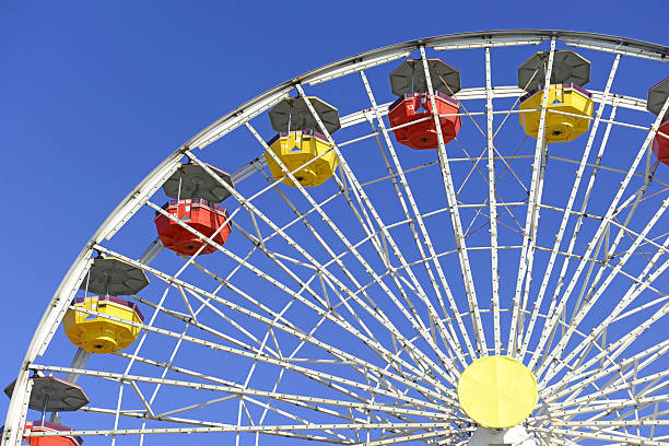 istock Colorful Ferris Wheel in amusement park with blue sky 522561803