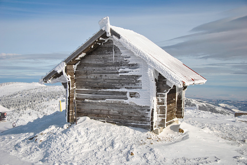 Small log house on the very peak of the mountain, a shelter for the ski lift staff and visitors, Mt.Kopaonik