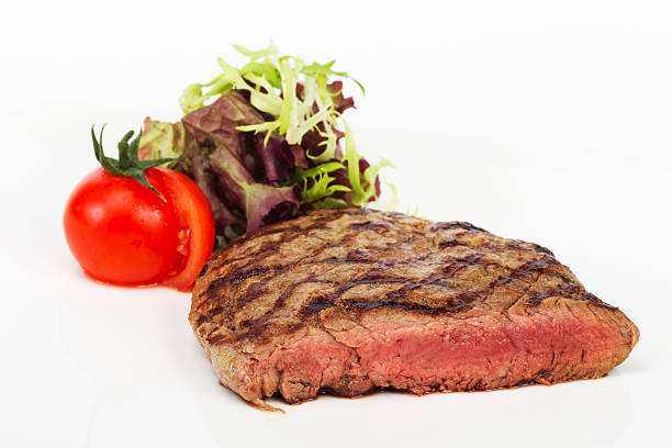 istock Steak with blood of beef with tomatoes, selective focus 522564651