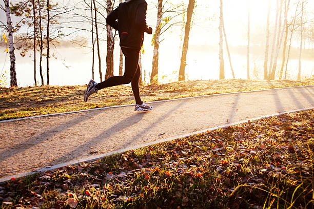 istock Man running at autumn during sunrise 522565931