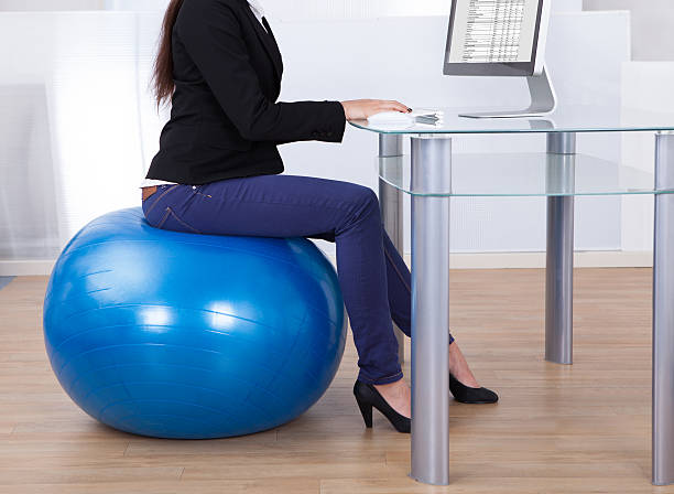 istock Businesswoman Working While Sitting On Pilates Ball 522565969
