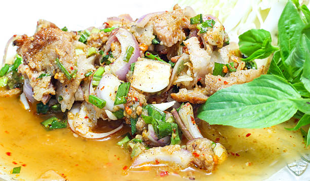 istock Sliced grilled pork salad in the dish with basil 522566091