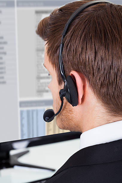 istock Call Center Consultant Wearing Headset In Office 522566651