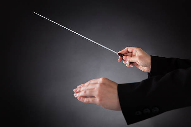 istock Female Orchestra Conductor With Baton 522566933
