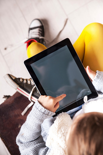 Urban school girl with tablet computer tablet.