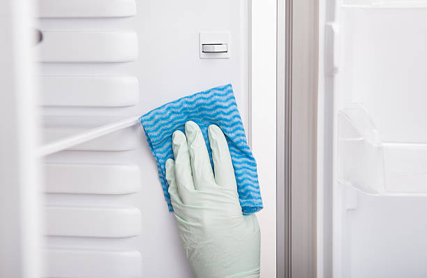 istock Woman Cleaning Refrigerator 522577965