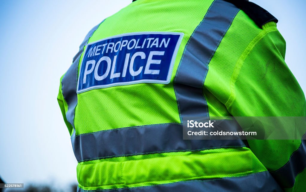 Metropolitan Police Officer Back view of a metropolitan police officer. Metropolitan Police Stock Photo