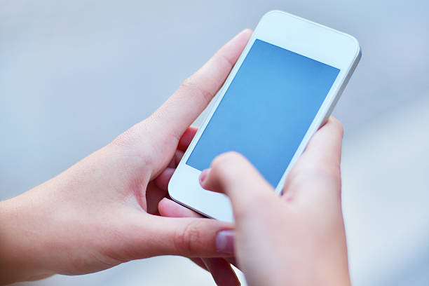 Woman typing on smart phone, close up from his hand.