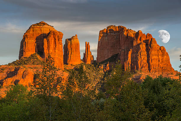 Cathedral Rocks at Sunset with Moon Cathedral Rocks at Sunset with rising moon in Sedona Arizona USA. red rocks state park arizona photos stock pictures, royalty-free photos & images