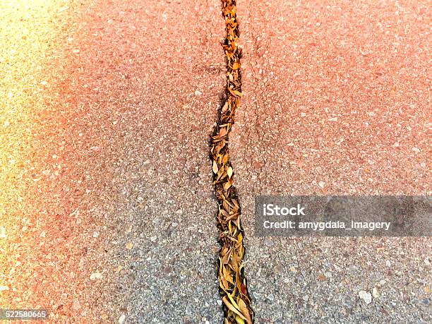 Mobilestock Cracks In The Pavement Stock Photo - Download Image Now - Asphalt, Autumn, Burning