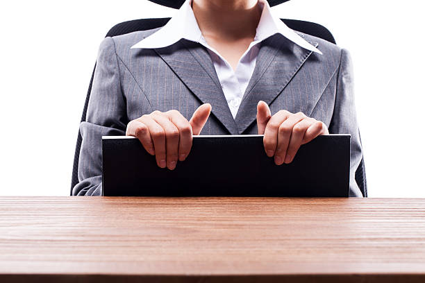 istock Businesswoman Holding Documents at Desk 522580891