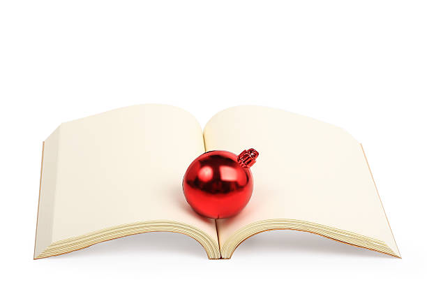 istock christmas ball on open book isolated 522582437