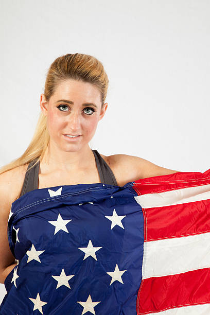 istock Blond woman wrapped in U.S. Flag 522583529