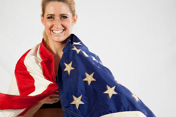 istock Blond woman wrapped in U.S. Flag 522583533
