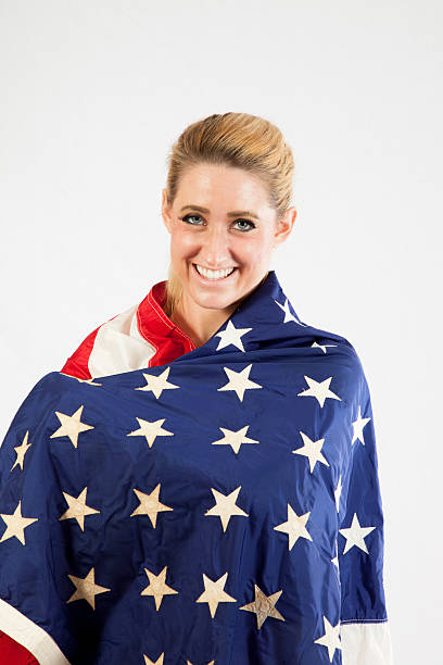 istock Blond woman wrapped in U.S. Flag 522583537