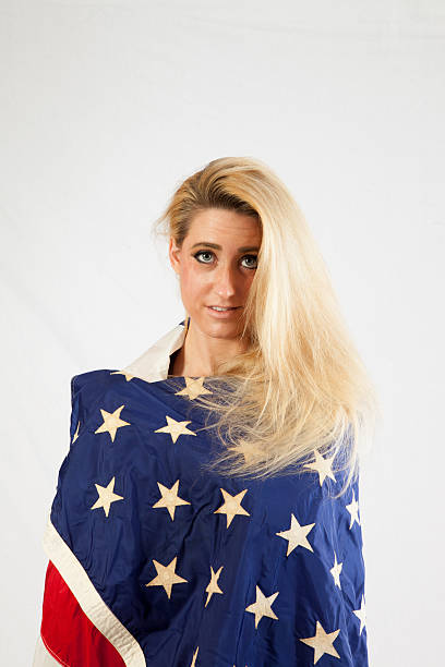 istock Blond woman wrapped in U.S. Flag 522583543