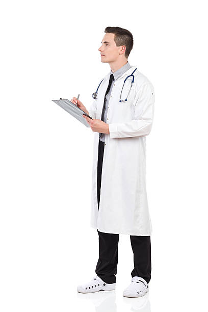 istock Thinking male doctor holding a clipboard 522584719