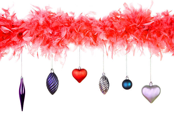 istock red feather with christmas decoration 522599011