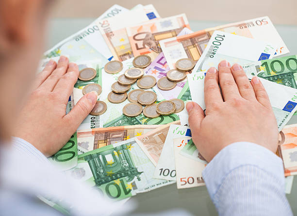 istock Businessperson With Banknotes And Coins 522600285