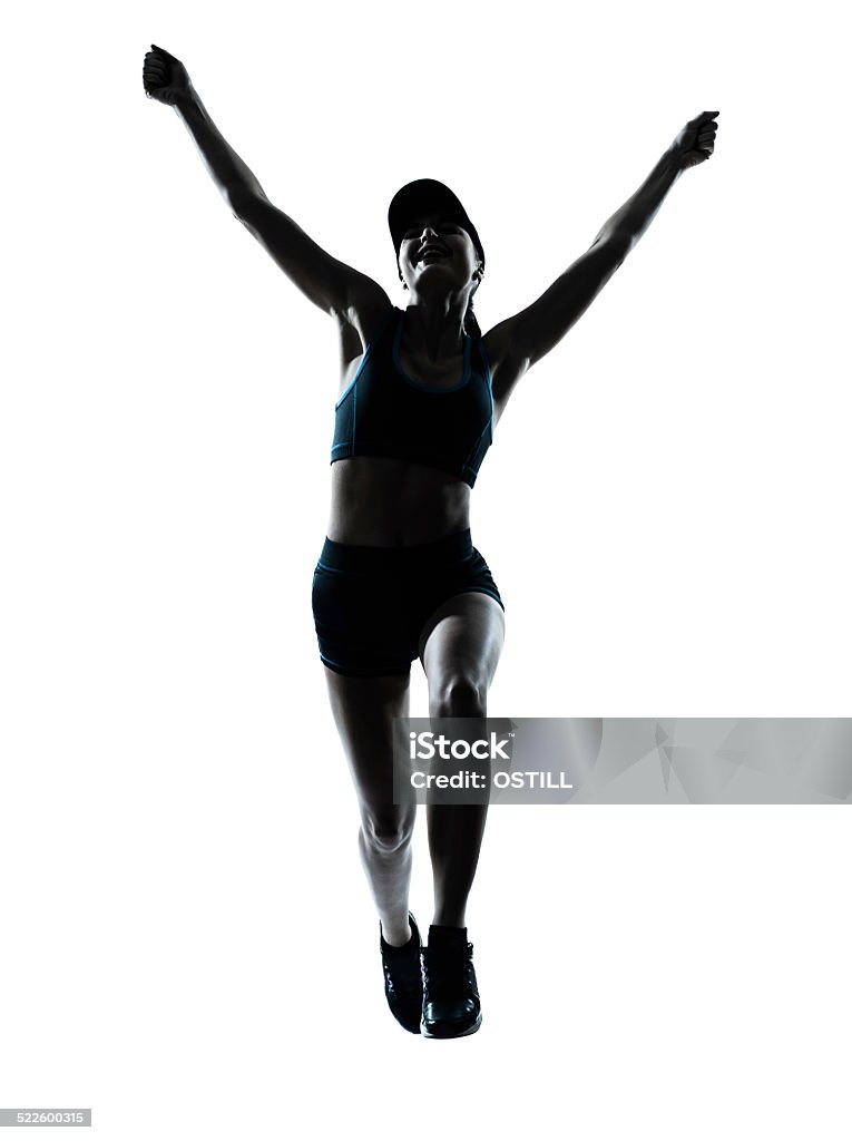 woman runner jogger jumping happy silhouette one  woman runner jogger jumping happy jumping in silhouette studio isolated on white background Women Stock Photo
