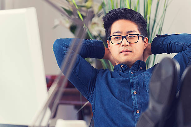 istock Asian Businessman Sitting At His Desk Relaxing 522600831