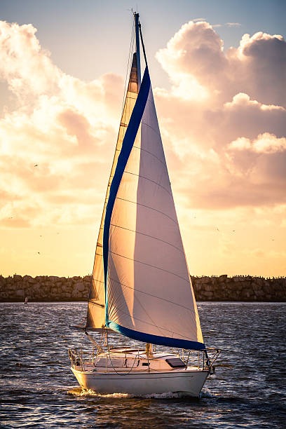 istock Sailboat Entering The Marina As The Sun Is Setting 522601099