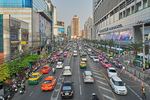 Bangkok, Thailand - February 26, 2014: Traffic moves slowly along a busy road on May 2, 2014 in Bangkok, Thailand. Annually an estimated 150,000 new cars join the already heavily congested streets of Bangkok. Bangkok, Thailand - February 26, 2014