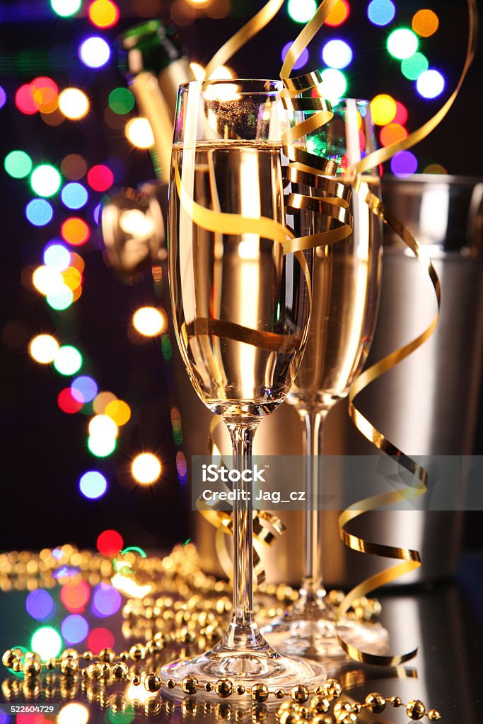 Glasses of champagne Glasses of champagne on black background with blur colored spot lights. Concept of celebration Alcohol - Drink Stock Photo