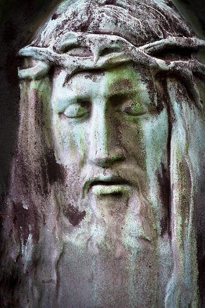 istock Jesus Christ face, closeup weathered statue 522619085
