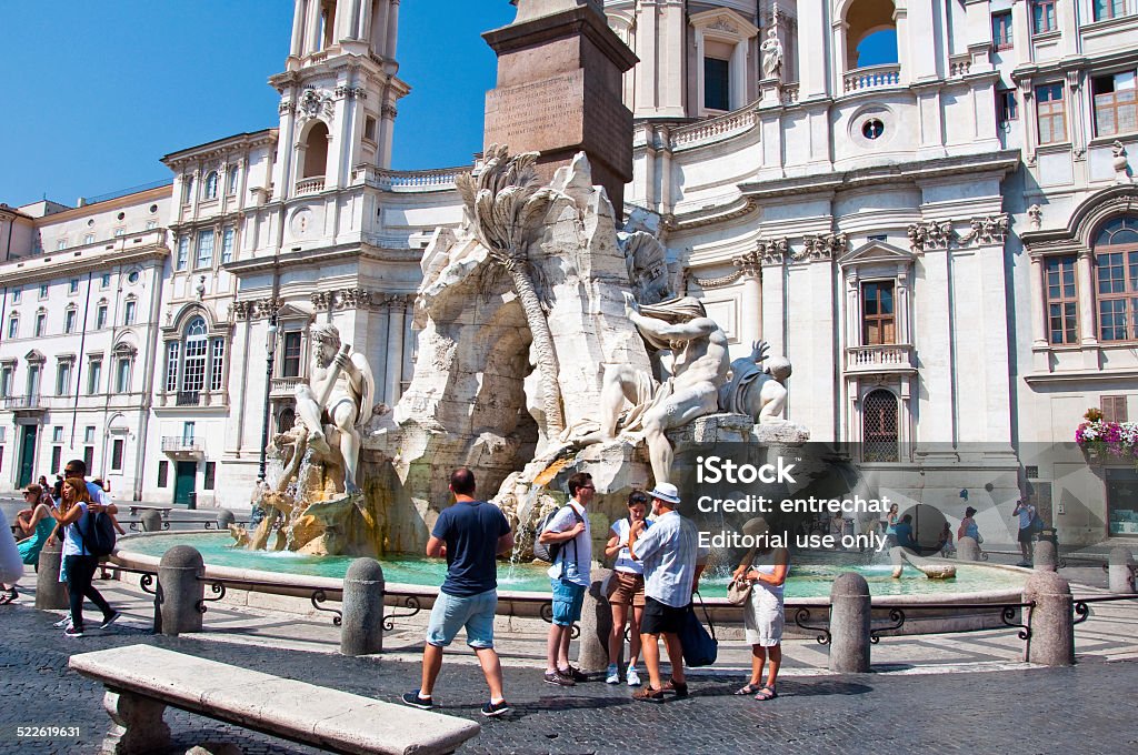 Fountain of the four Rivers on Piazza Navona. Rome, Italy. Rome, Italy - August 8, 2013: Fountain of the four Rivers on Piazza Navona with tourists around. Rome. Italy. Architecture Stock Photo