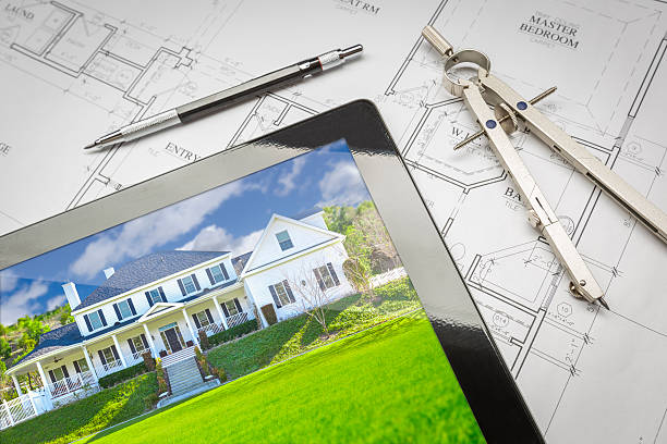 istock Computer Tablet Showing House Image On House Plans, Pencil, Comp 522619704