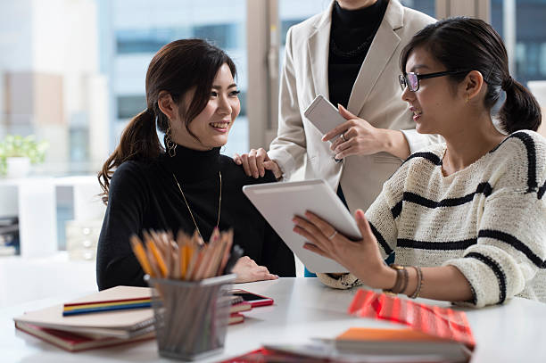 istock Designers have meeting while looking at the design of tablet 522619828