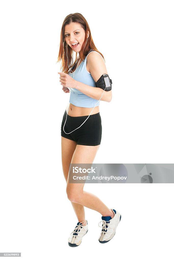 Smiling fitness women Running fitness women with mp3 player. Isolated on white Adult Stock Photo