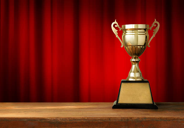 istock champion golden trophy on wood table 522620724
