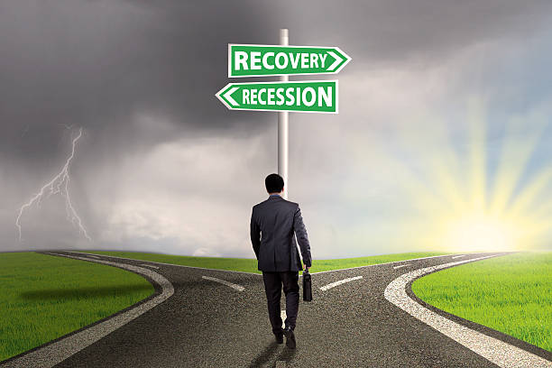 istock Man on the road with finance signpost 522621212