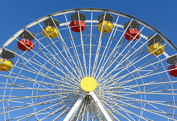 istock Colorful Ferris Wheel in amusement park with blue sky 522621385