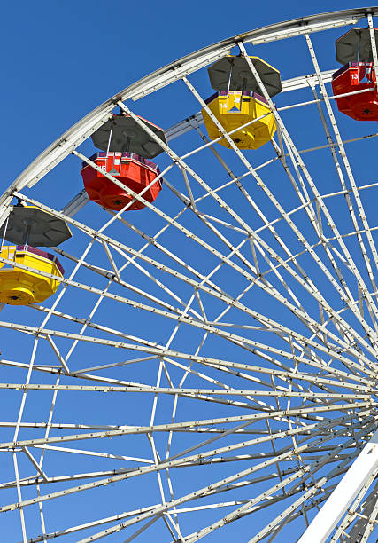 istock Colorful Ferris Wheel in amusement park with blue sky 522621395