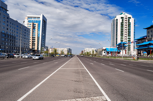 Astana, Kazakhstan - May 10, 2014: Building of Eurasian Financial Group Astana. Astana is the capital city of Kazakhstan on 10 December 1997.  Population of 835153. People walking on the street