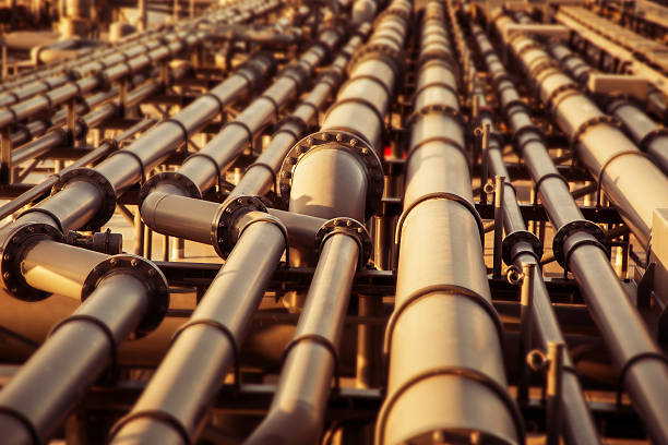 olio pipeline colorato sfondo sfocato. - industria petrolifera foto e immagini stock
