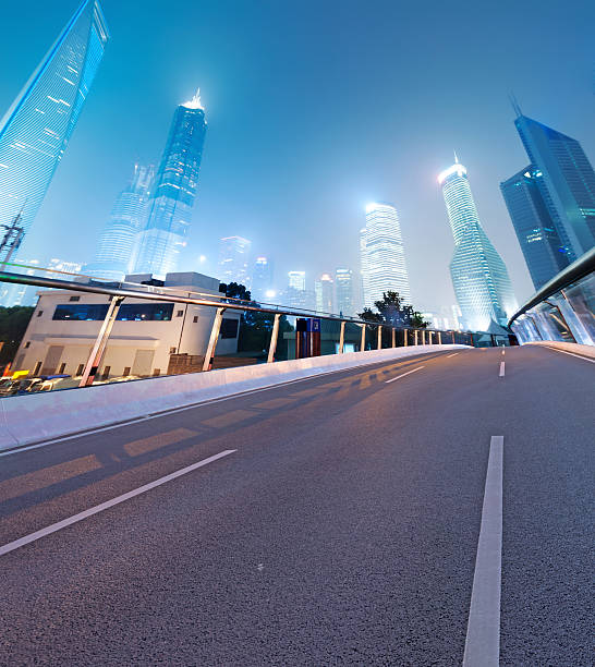 istock Asphalt road and modern city 522625517