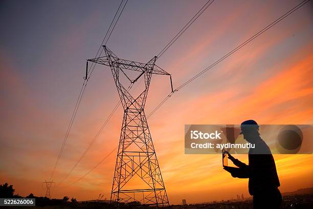 Electrical Engineer While Working Laptopl Stock Photo - Download Image Now - Electrical Grid, Power Line, Electricity