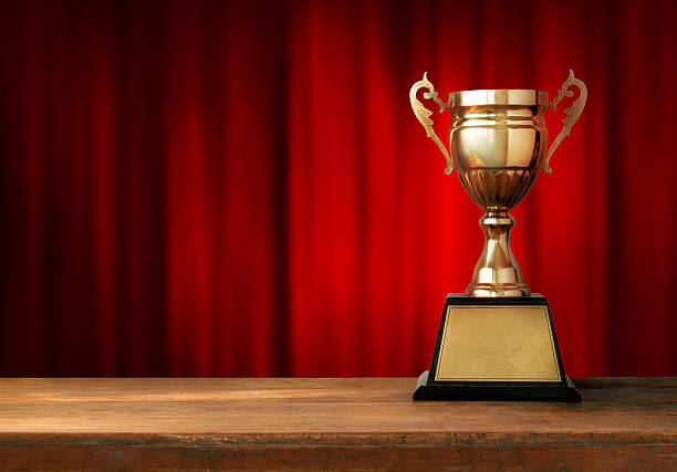 istock throphy in front of the red curtain 522626222