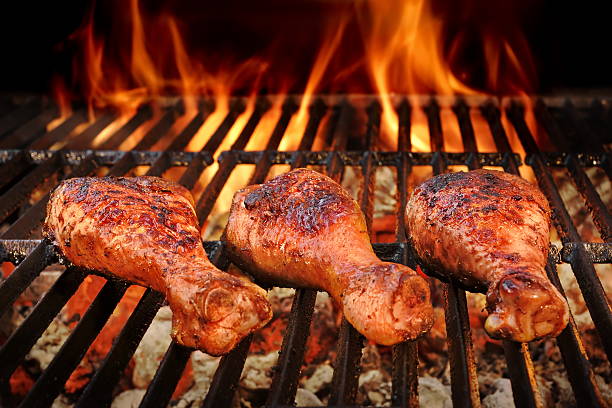 BBQ Chicken Legs Roasted On Hot Charcoal Grill stock photo