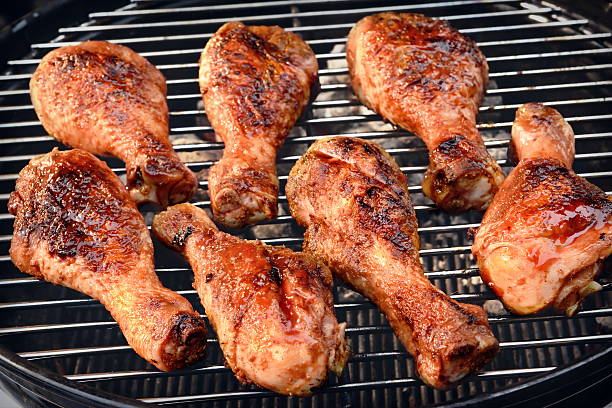 istock BBQ Chicken Legs Roasted On Hot Charcoal Grill 522628674
