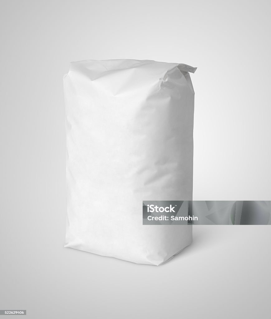 White blank paper bag package of flour on gray Blank white paper bag package of salt on gray with clipping path Flour Stock Photo