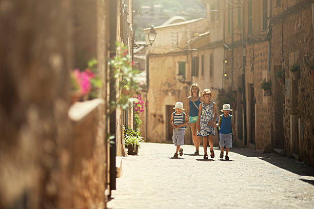 Family visiting beautiful mediterranean town.